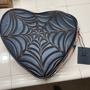 Love Pain and Stitches Orange and Black Heart backpack